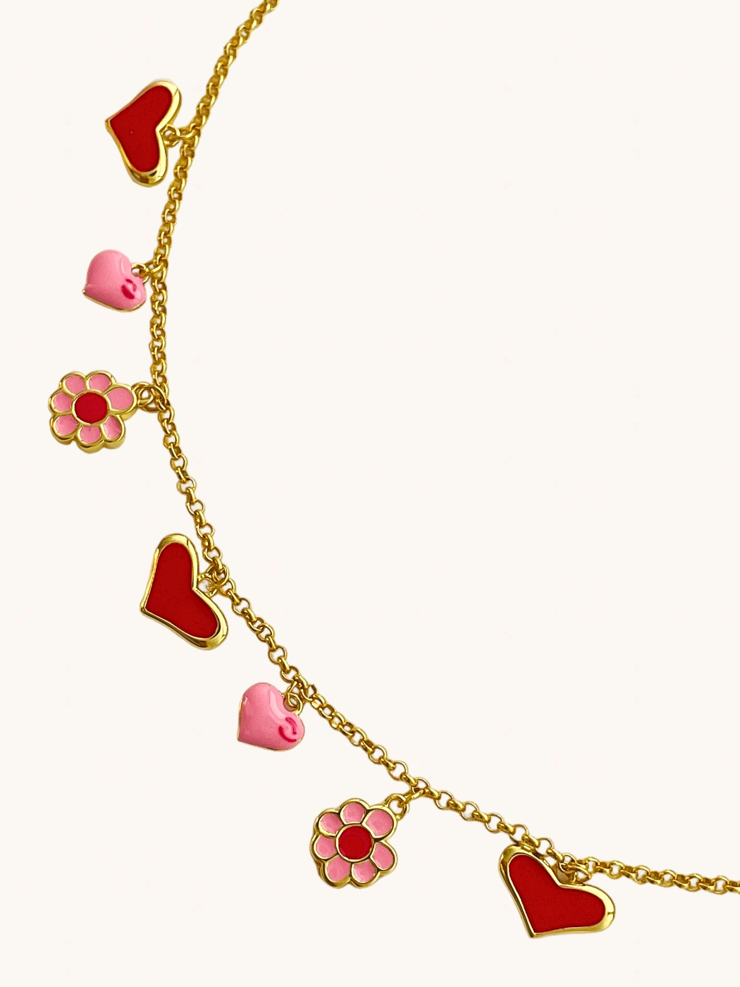 Closeup of Little Princess Hearts and Flower Charm Necklace in 18k Gold Plated Silver Adjustable Length 925 Sterling Metal 14 inches 7.2gms