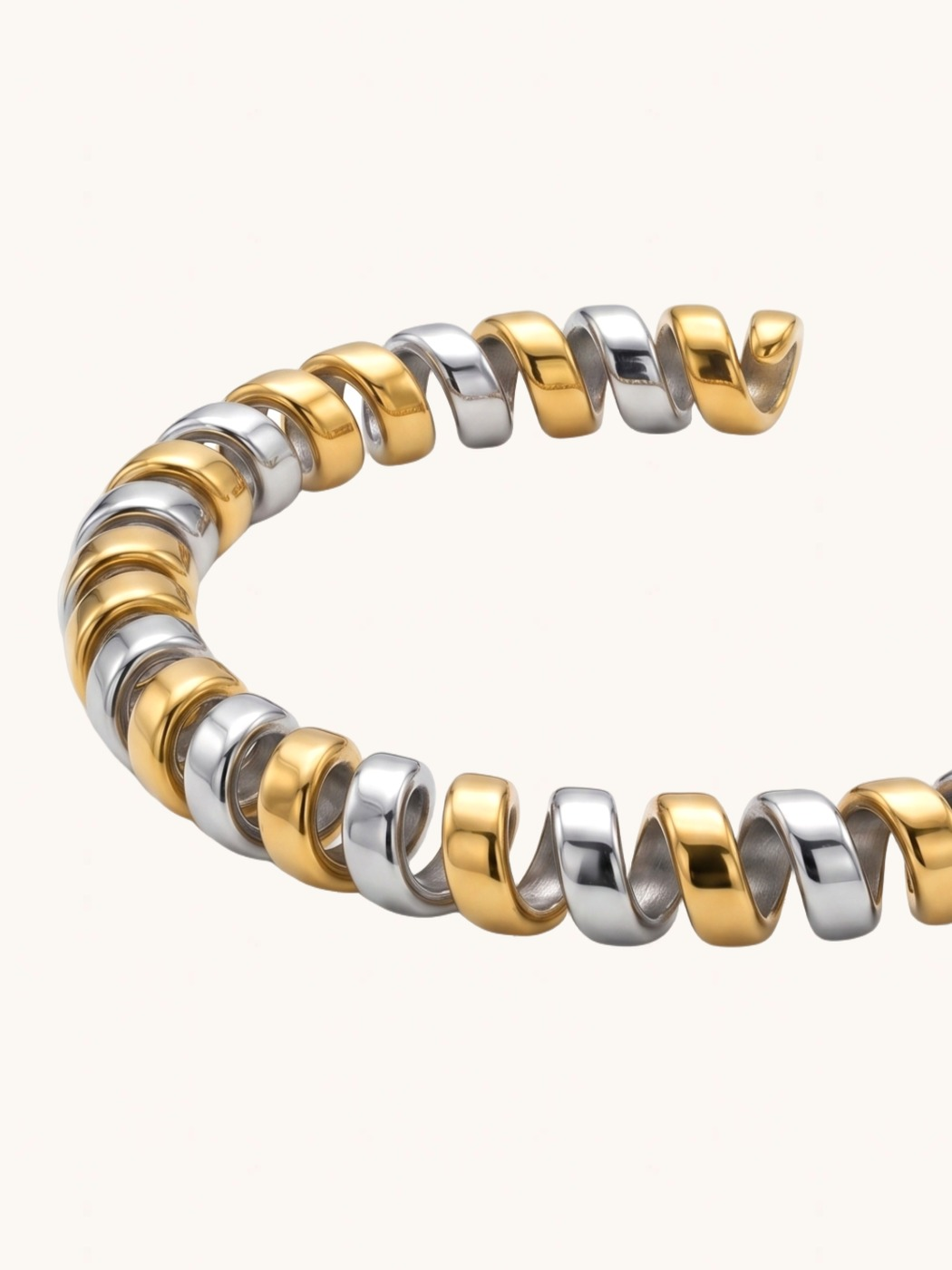 Closeup of Twila Spiral Bangle in Two-Tone Metal Comfort Fit 18k Gold Plated Steel | Hypoallergenic Tarnish Resistant Sweat Water 8 inches 16.7gms Stainless