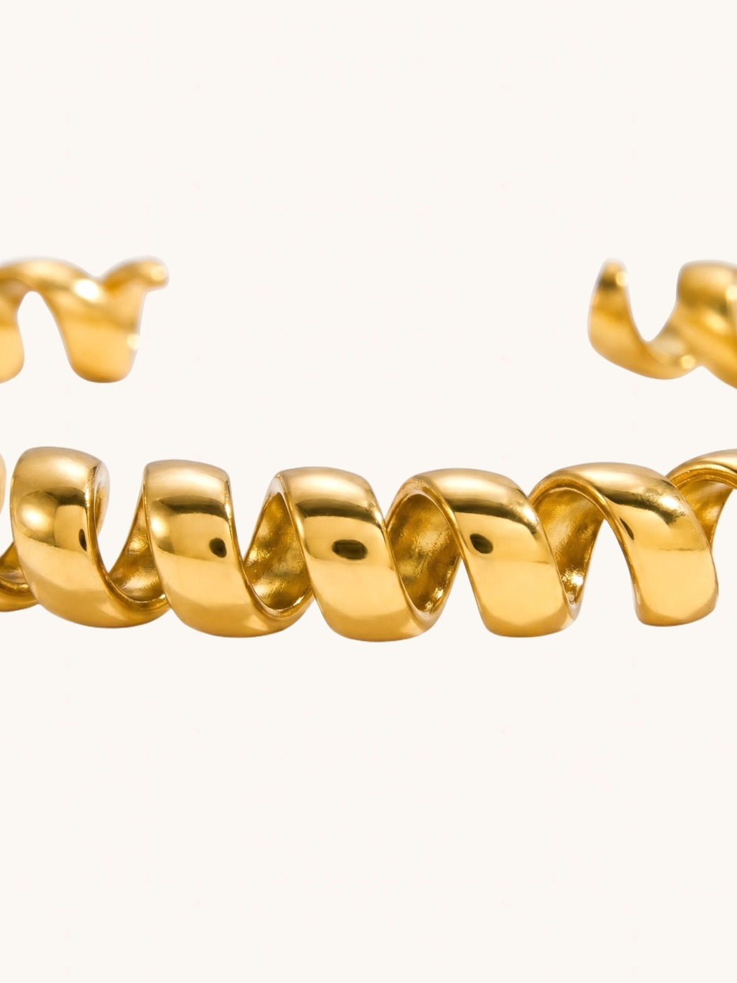 Closeup of Twila Spiral Bangle in Gold-Tone Metal Comfort Fit 18k Gold Plated Steel | Hypoallergenic Tarnish Resistant Sweat Water 8 inches 20.1gms Stainless