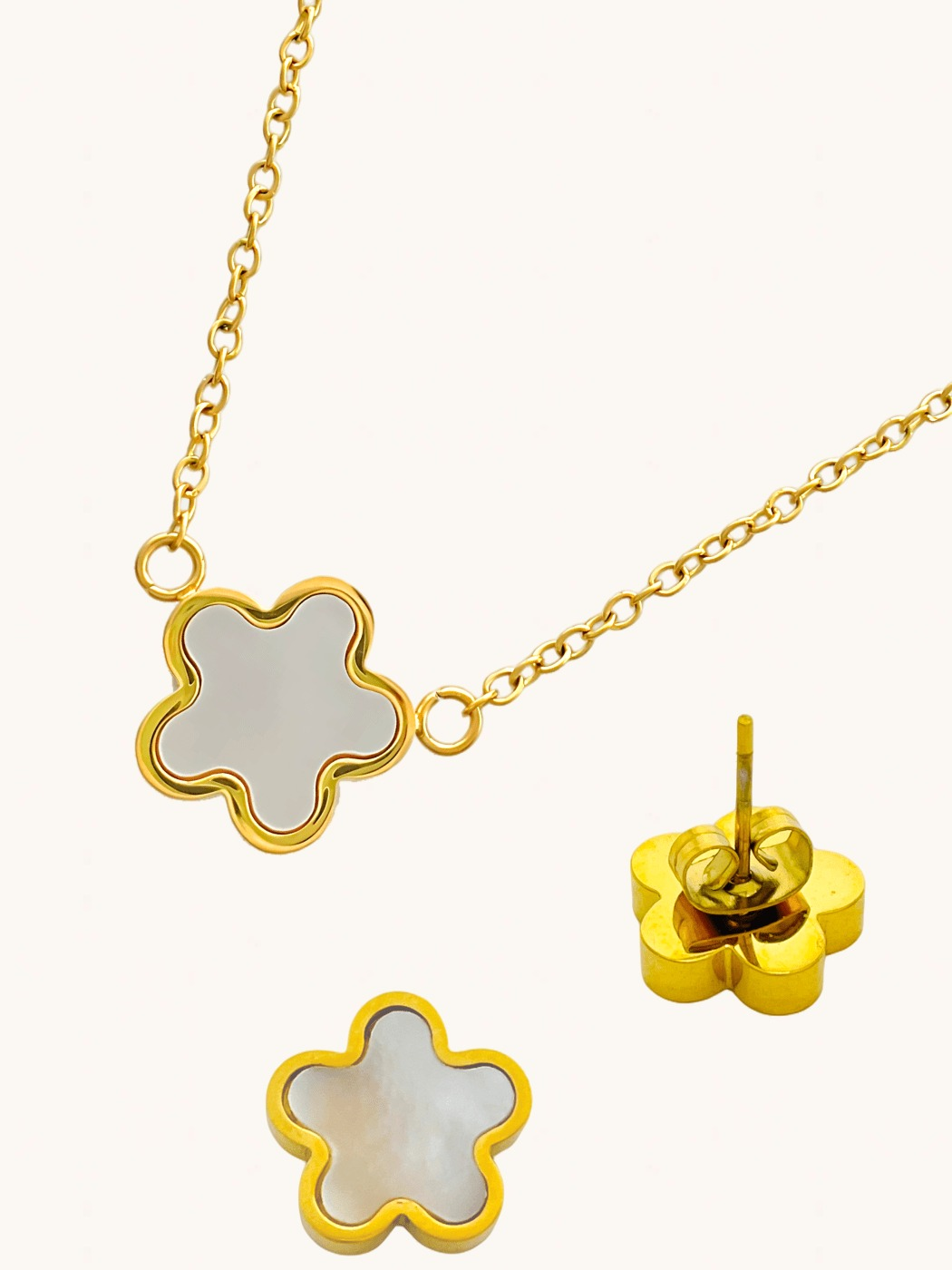 Closeup of Freya Flower Pendant & Stud Earrings Set in 18k Gold-Plated Metal Adjustable Length Gold Plated Steel | Hypoallergenic Tarnish Resistant Sweat Water One Size 12gms