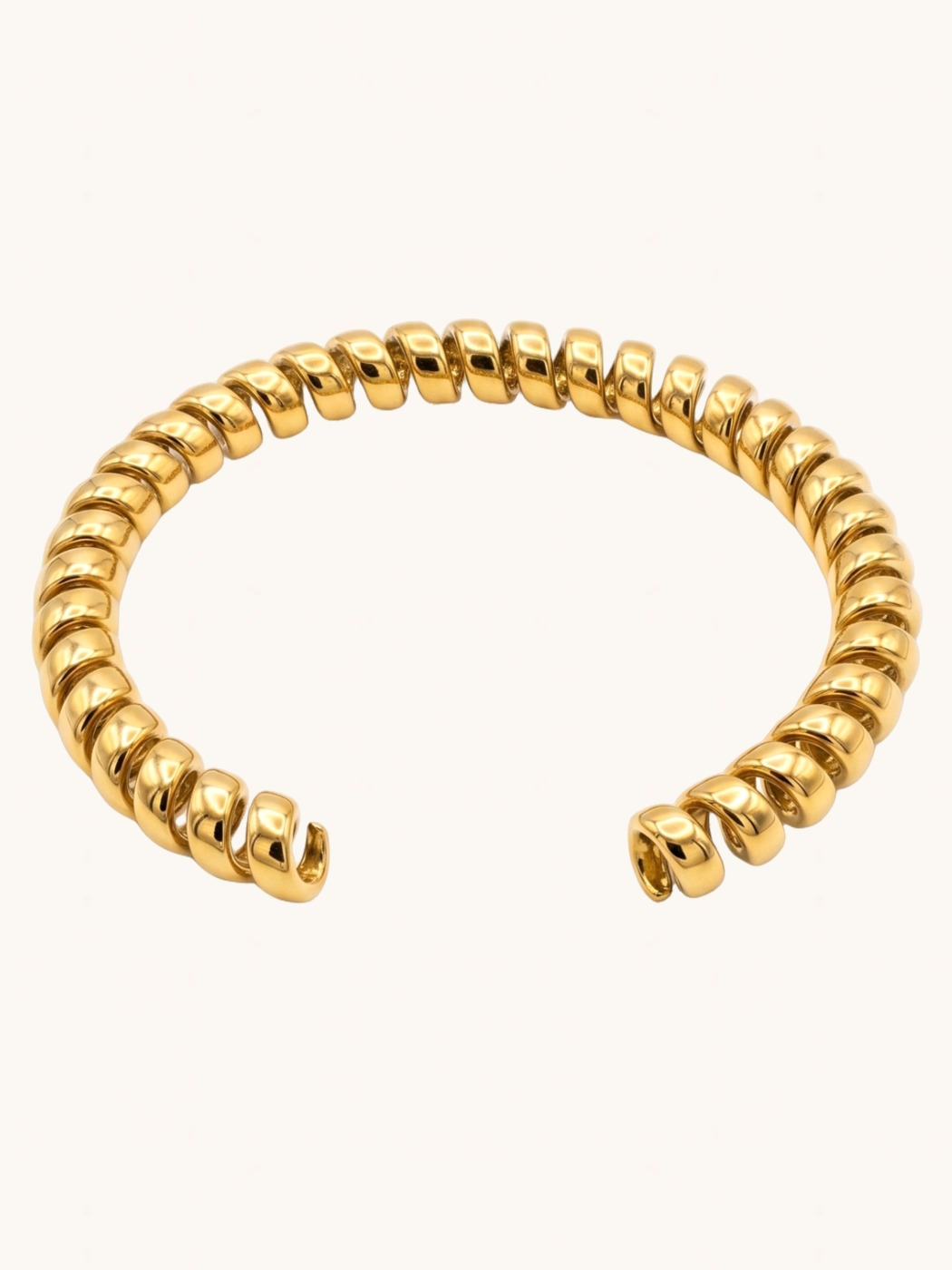 Rear View of Twila Spiral Bangle in Gold-Tone Metal Comfort Fit 18k Gold Plated Steel | Hypoallergenic Tarnish Resistant Sweat Water 8 inches 20.1gms Stainless