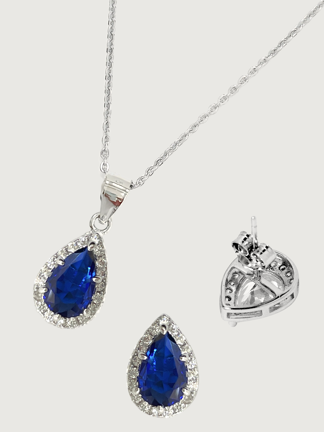 Closeup of Zia Drop Pendant Necklace & Stud Earrings in 925 Sterling Silver - Blue Fixed Length Metal 16 inches 4.6gms