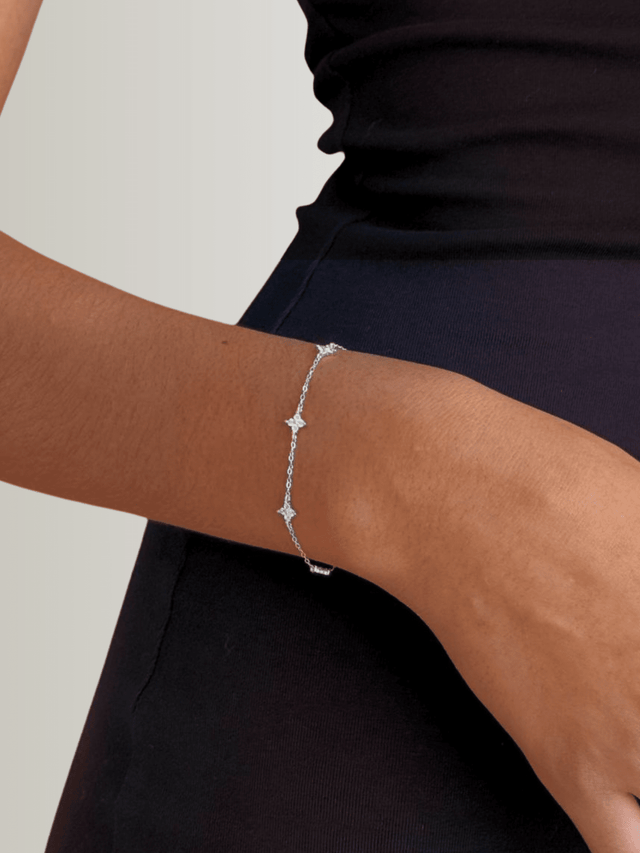 Model Wearing Irene Star Charm Bracelet in 925 Sterling Silver Adjustable Length Metal 7.5 inches 1.3gms
