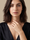 Model Wearing Irene Star Hand Chain Bracelet Comfort Fit 18k Gold Plated 925 Sterling Silver One Size 1.5gms