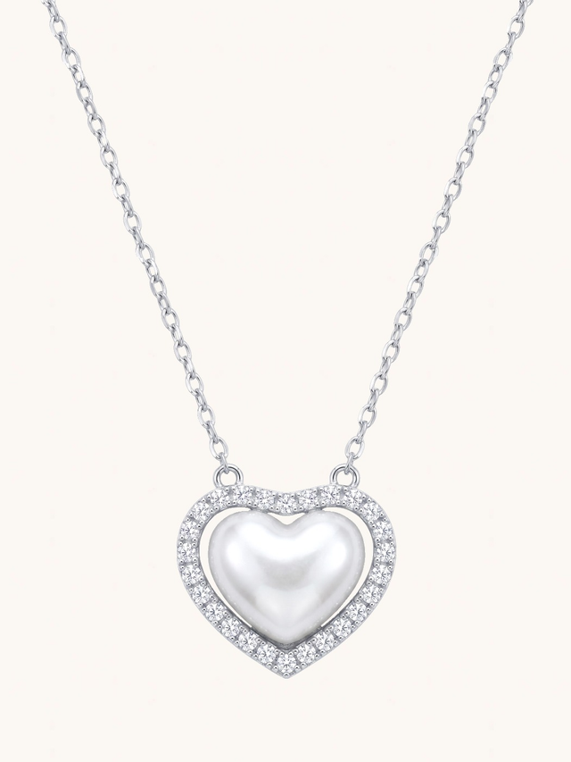 Amora Silver Heart Pendant Necklace on a plain cream background