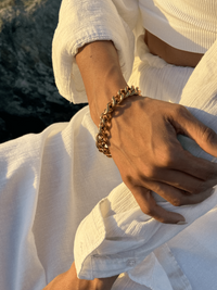 Model Wearing Anchor Bracelet in 18K gold Plated Metal Adjustable Length 18k Gold Steel | Hypoallergenic Tarnish Resistant Sweat Water Eco - Friendly One Size 40.2gms