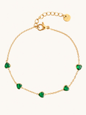 Bezel Heart Bracelet on a plain cream background