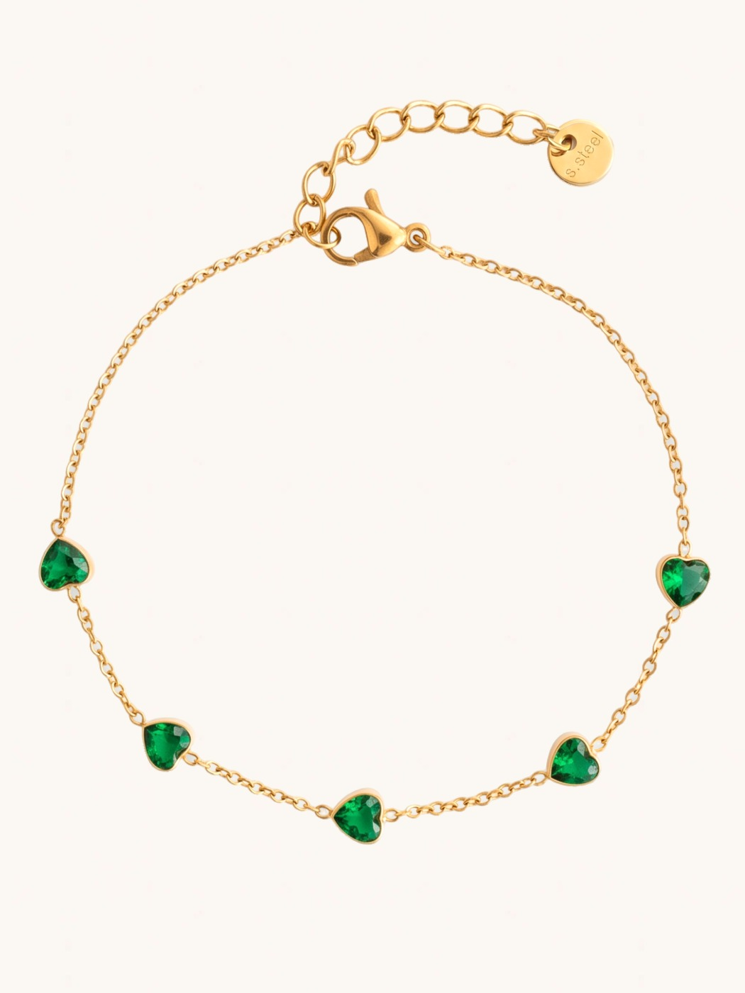 Bezel Heart Bracelet on a plain cream background