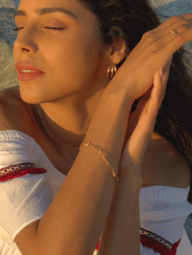 Model Wearing Celine Paperclip Bracelet in 18K Gold Plated Metal Adjustable Length 18k Steel | Hypoallergenic Tarnish Resistant Sweat Water Eco - Friendly One Size 3.1gms