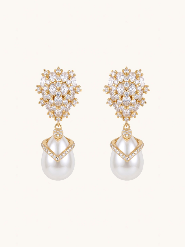 Ellara Pearl Dangle Earrings on a plain cream background