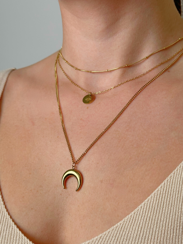 Model Wearing Laira Layered Necklace in 18K Gold-Plated Metal Fixed Length 18k Gold Plated Steel | Hypoallergenic Tarnish Resistant Sweat Water Eco - Friendly One Size 9.8gms Stainless