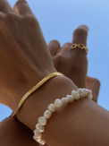 Model Wearing Raia Waterproof Bracelet in 18K Gold Plated Metal Adjustable Length 18k Steel | Hypoallergenic Tarnish Resistant Sweat Water Eco - Friendly One Size 3.5gms