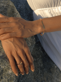 Alternate View of Model Wearing Raia Waterproof Bracelet in 18K Gold Plated Metal Adjustable Length 18k Steel | Hypoallergenic Tarnish Resistant Sweat Water Eco - Friendly One Size 3.5gms