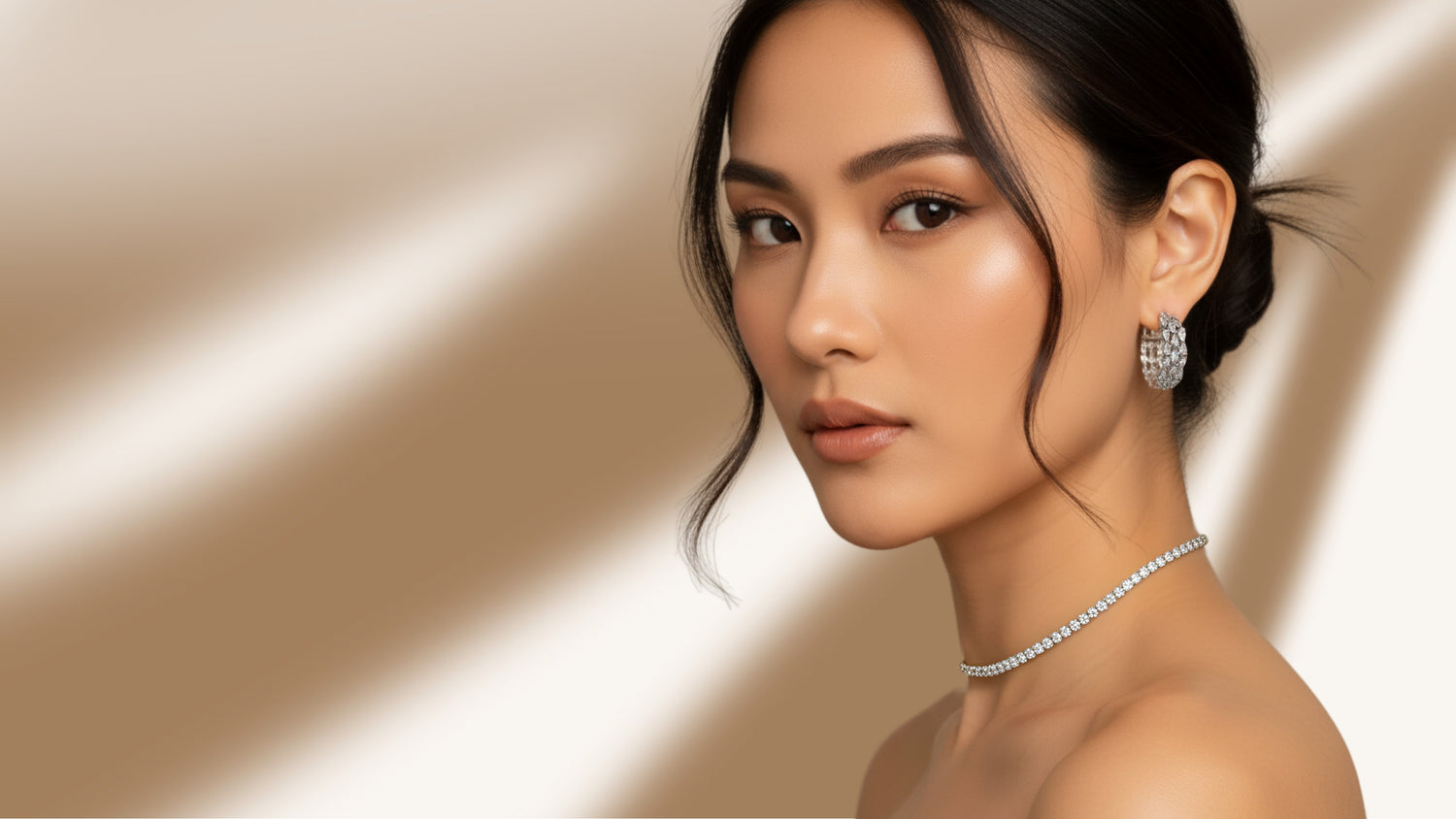 Elegant woman wearing sparkling cubic zirconia choker necklace and statement earrings from The Jewels Jar