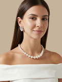 Alternate View of Model Wearing Cattleya Pearl Stud Earrings Jewelry for Pierced Ears Post / Pin & Push in 925 Sterling Silver Stamp Marked Rhodium Plated Copper 25.54 mm 8.5gms